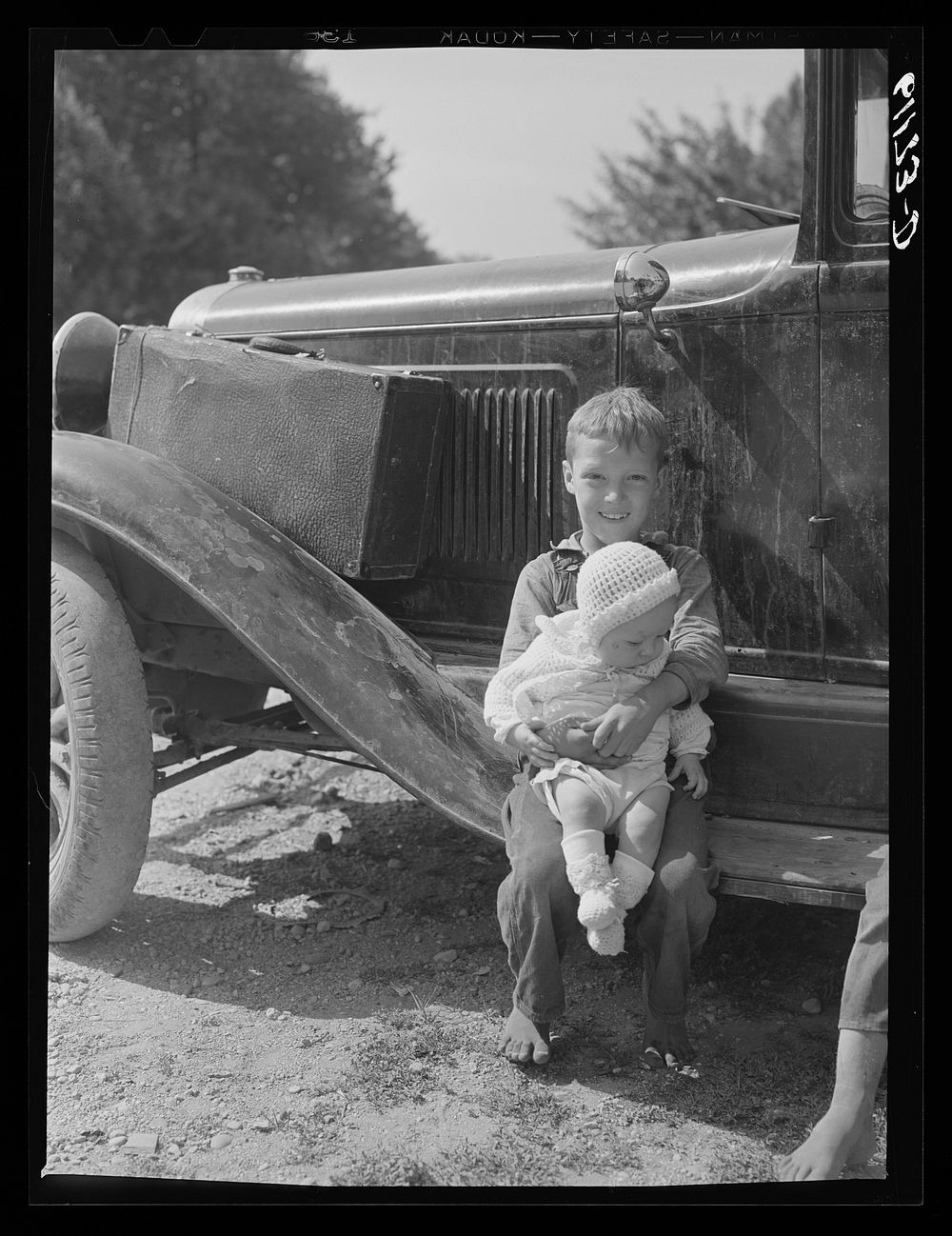 Children of migratory fruit worker Berrien County, Michigan. Boys this age often do a full day's work in strawberries or…