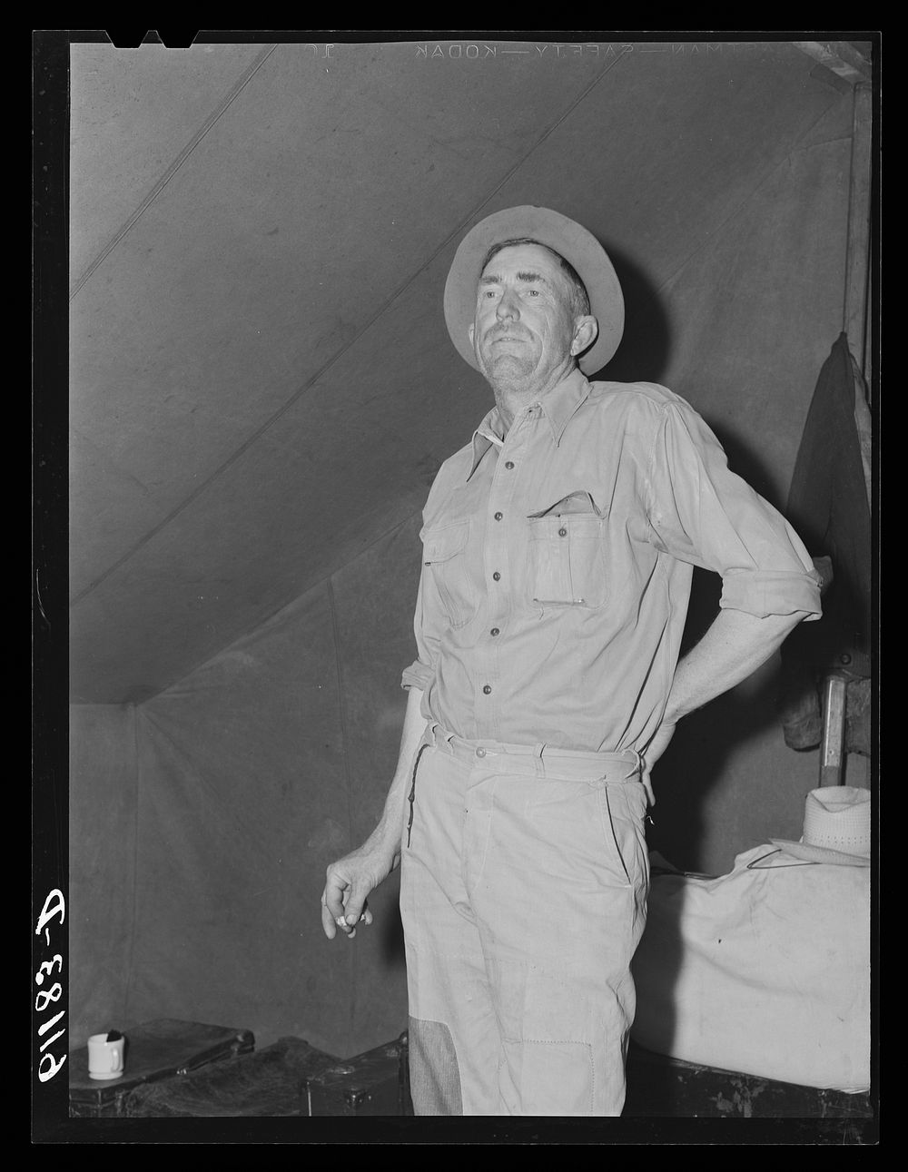 Migratory fruit worker in his tent. Berrien County, Michigan. Sourced from the Library of Congress.