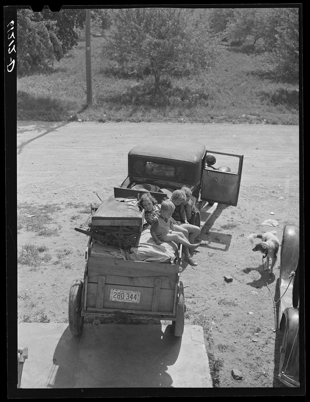 Family of migrants from Arkansas ready to move to new work location. Berrien County, Michigan. Sourced from the Library of…