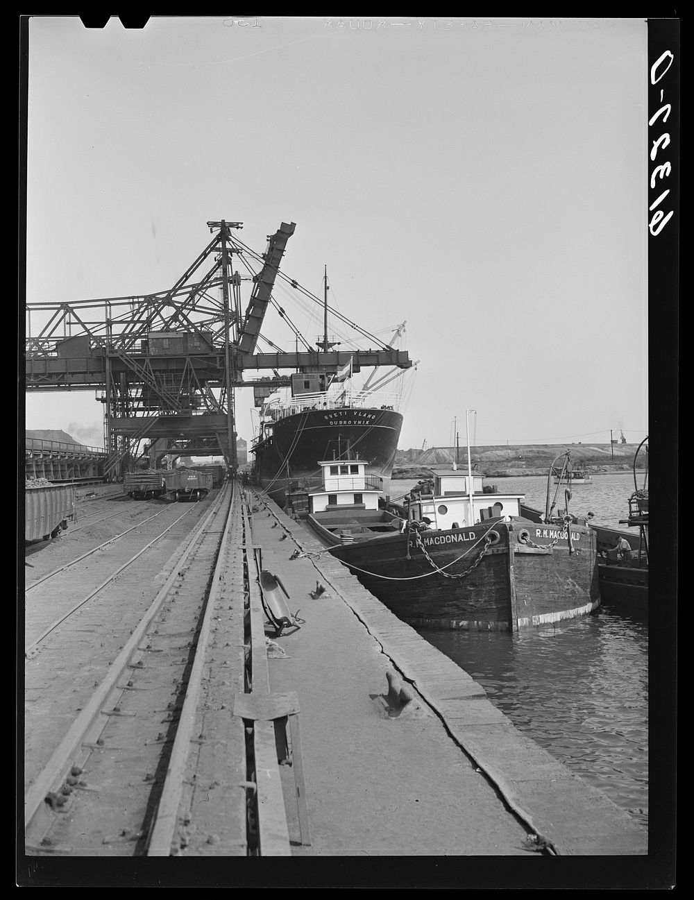 Unloading iron ore at Bethlehem steel mill. Sparrows Point, Maryland. Sourced from the Library of Congress.