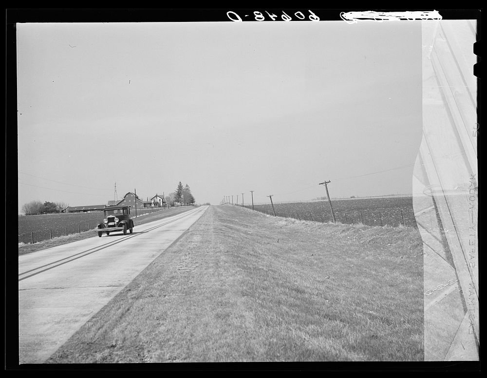 Highway through fertile land of Grundy County, Iowa. Sourced from the Library of Congress.