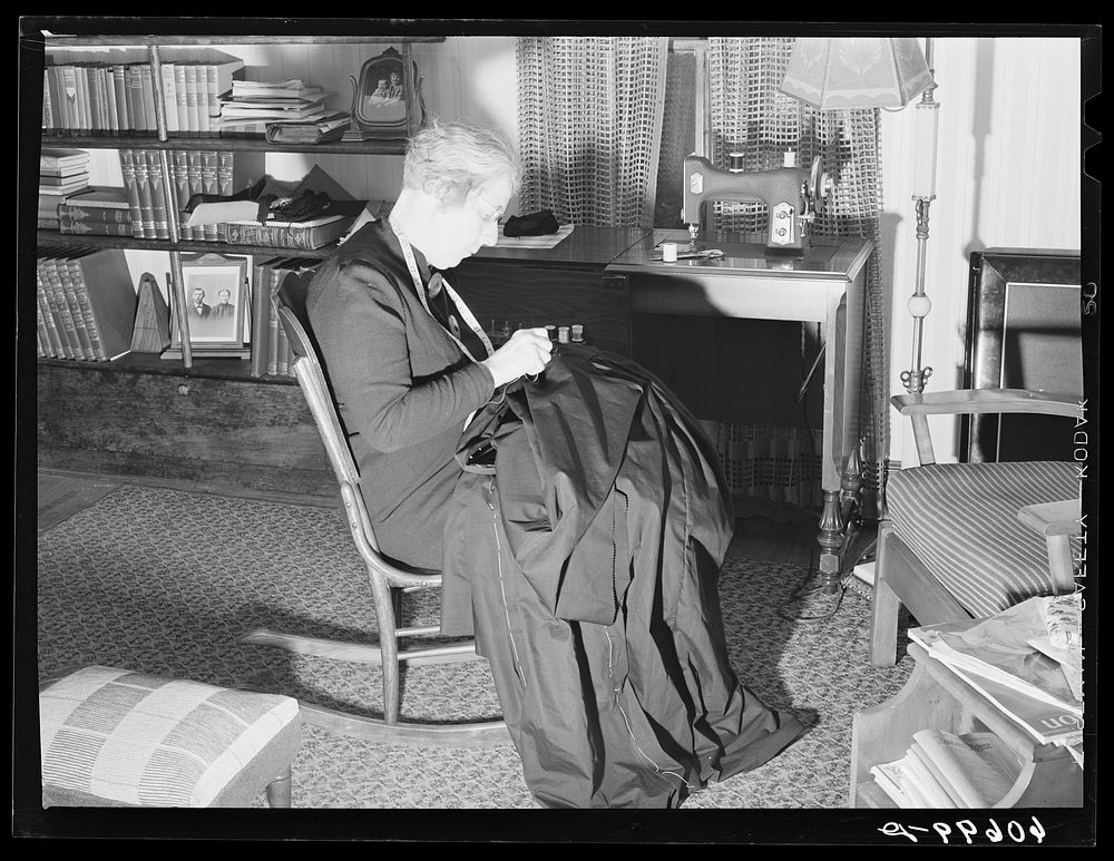 Wife of Iowa corn farmer sewing choir robes for Methodist church. Greene County, Iowa. Sourced from the Library of Congress.
