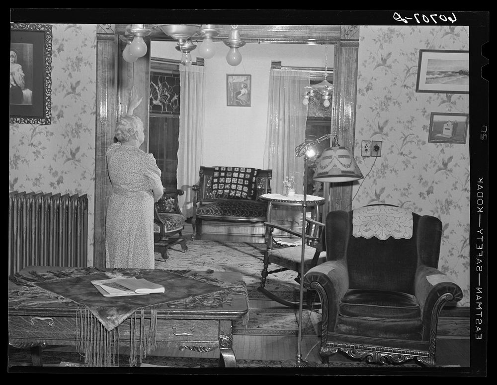 Closing sliding door to little-used parlor. Home in Scranton, Iowa. Sourced from the Library of Congress.
