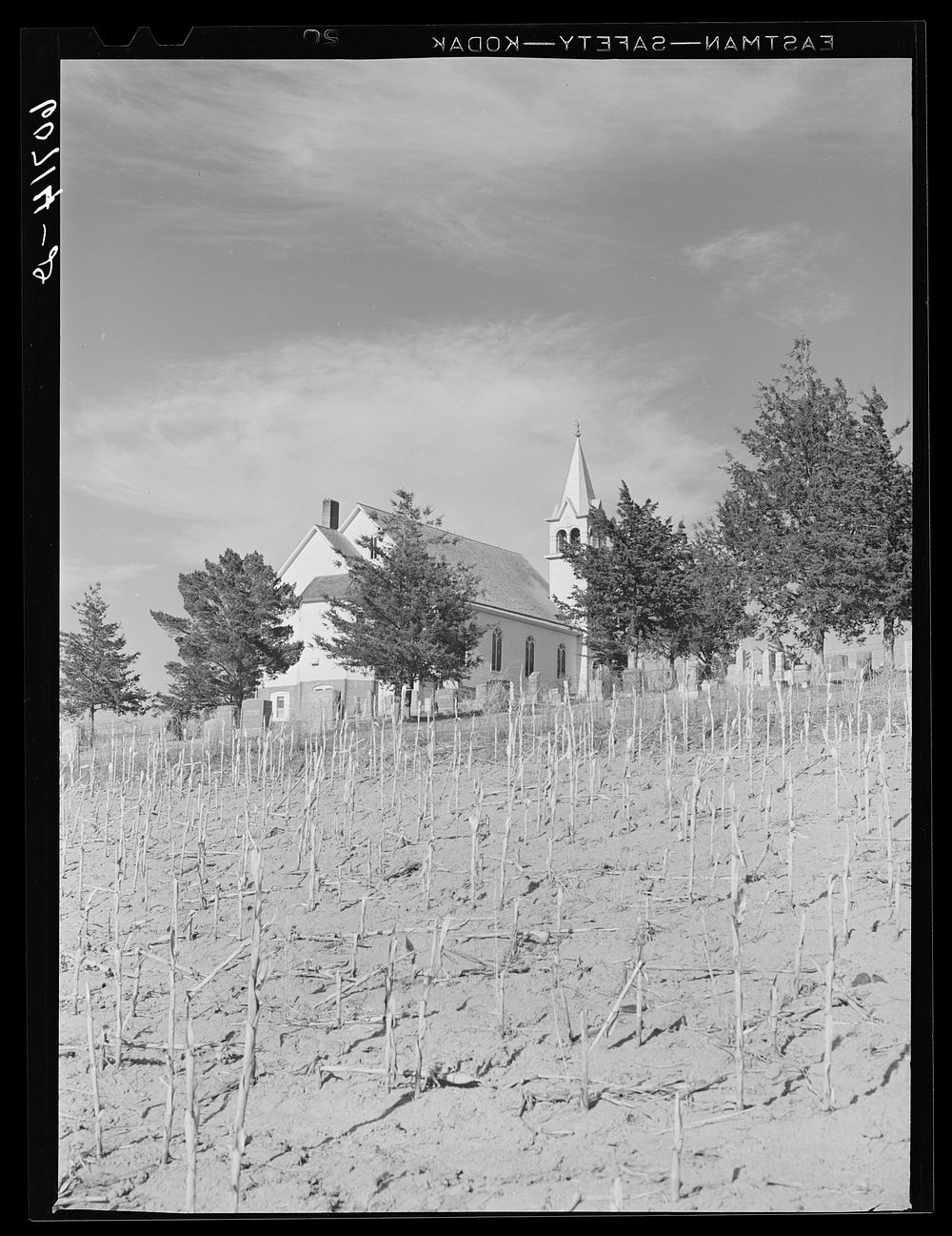 [Untitled photo, possibly related to: Country church and cornfield. Monona County, Iowa]. Sourced from the Library of…