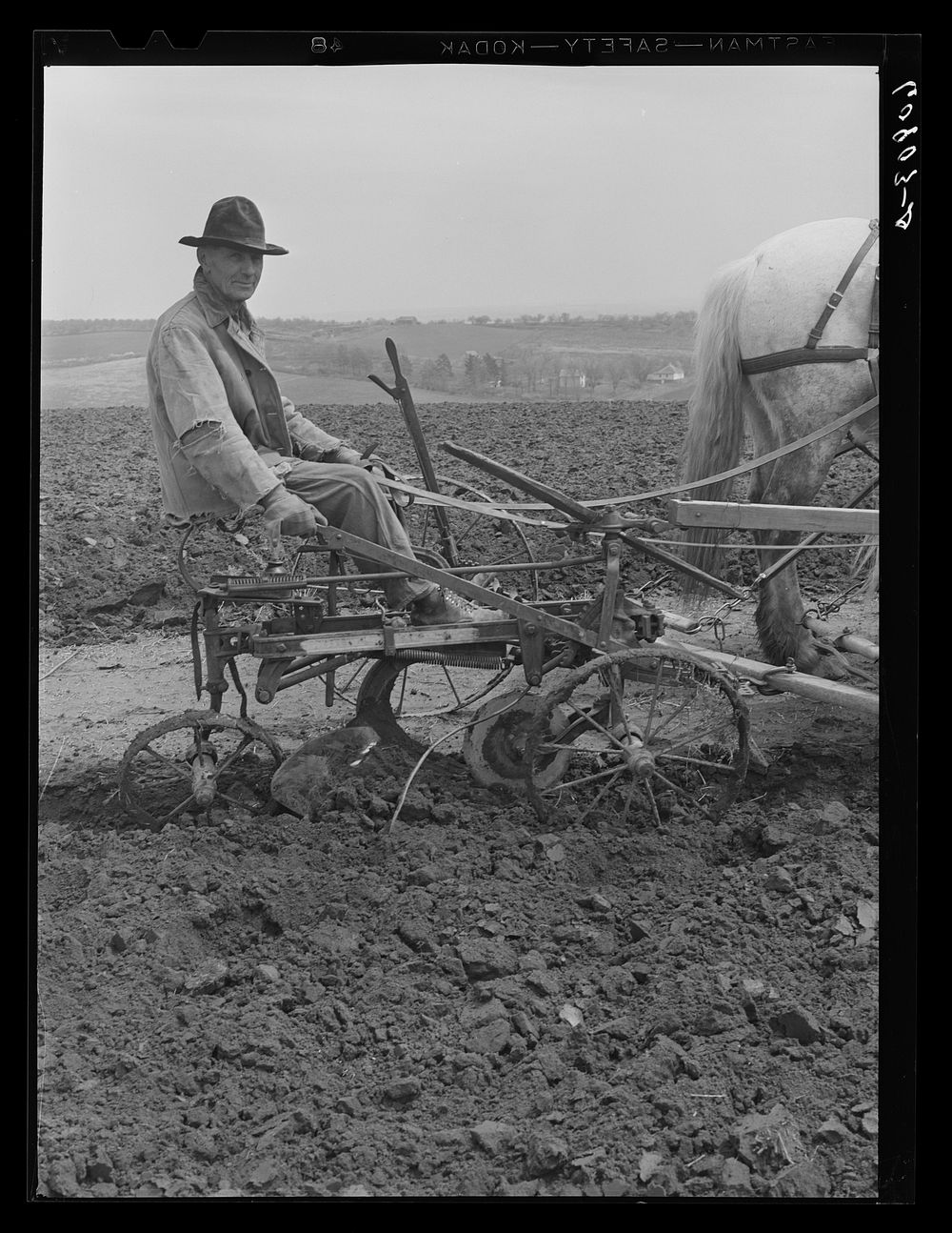 [Untitled photo, possibly related to: Eighty year old corn farmer. Harrison County, Iowa]. Sourced from the Library of…