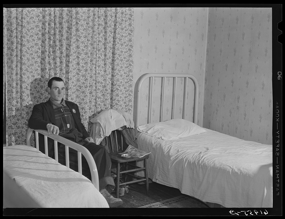 Powder plant's construction worker in his bedroom at Mrs. Pritchard's boardinghouse. Radford, Virginia. Sourced from the…