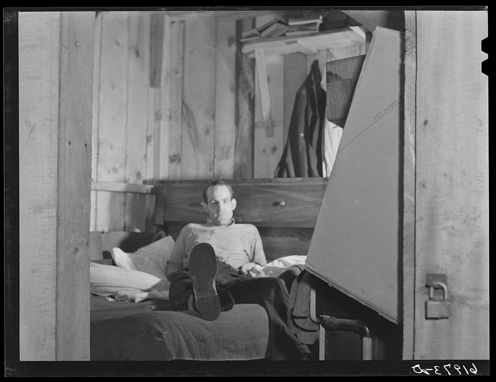 [Untitled photo, possibly related to: W.W. McDaniel, rigger at Hercules powder plant, in his bunkhouse in the rear of Mrs.…