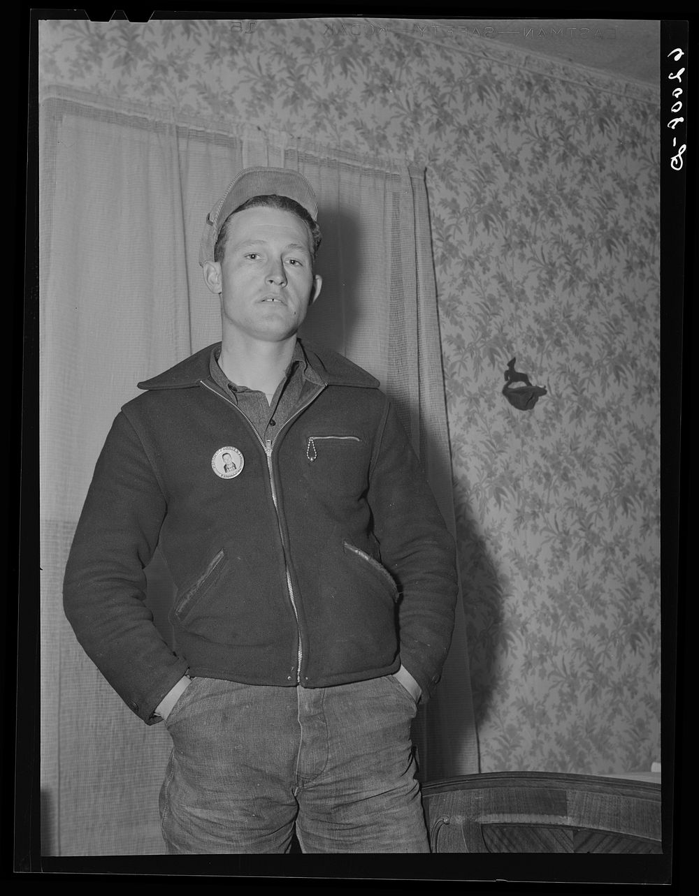 Paul McDaniel with his laborer's button. Each employee wears an identification. Sourced from the Library of Congress.