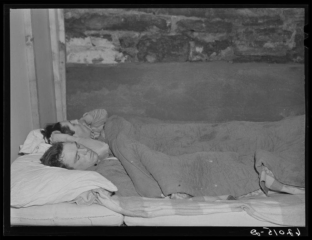 [Untitled photo, possibly related to: Two boys employed at powder plant sleeping in basement of Mr. Tilly's furniture store.…