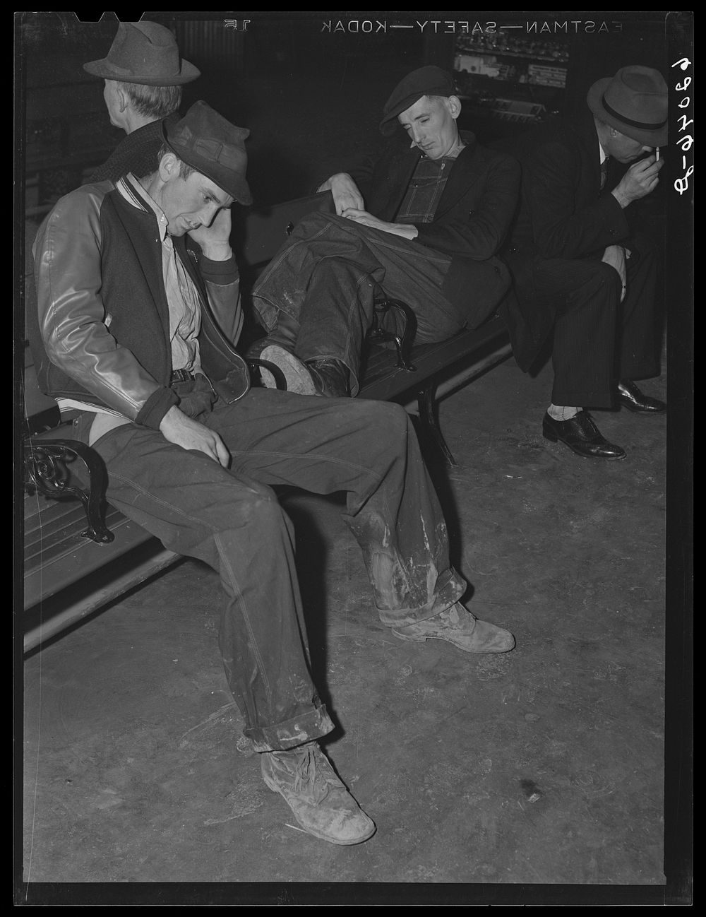 Men spending the night in railroad station. Radford, Virginia. Sourced from the Library of Congress.