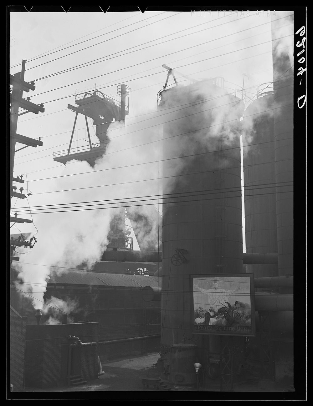 [Untitled photo, possibly related to: "Peace be unto you" sign at steel plant. Birmingham, Alabama]. Sourced from the…