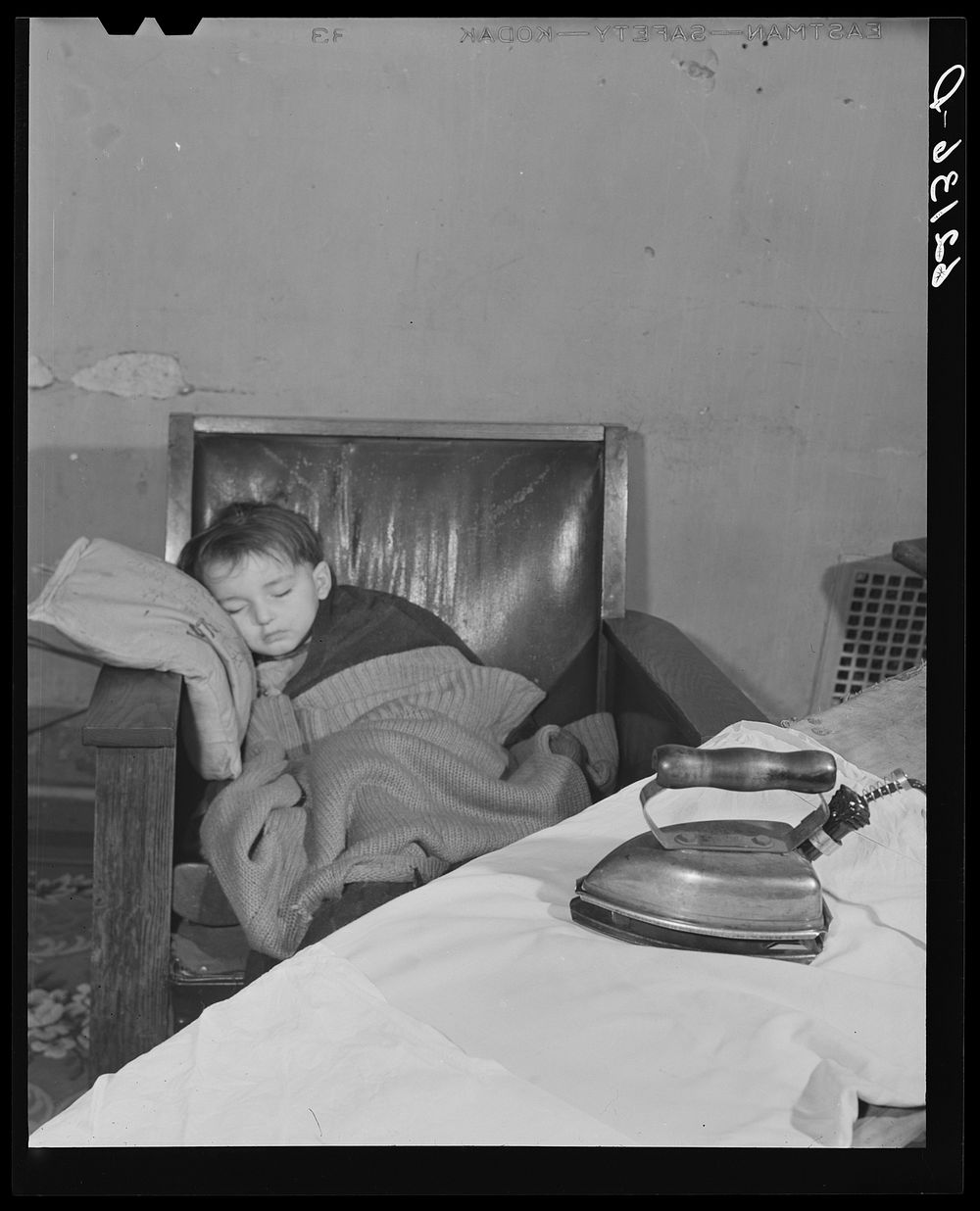 Child of unemployed steelworker sleeping. Ambridge, Pennsylvania. Sourced from the Library of Congress.