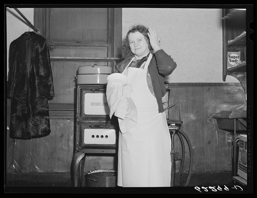 [Untitled photo, possibly related to: Woman drying dishes. Ambridge, Pennsylvania]. Sourced from the Library of Congress.