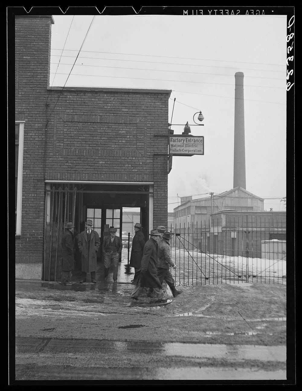 [Untitled photo, possibly related to: Quitting time. National Electric Products Comapany. Man on right is company detective.…