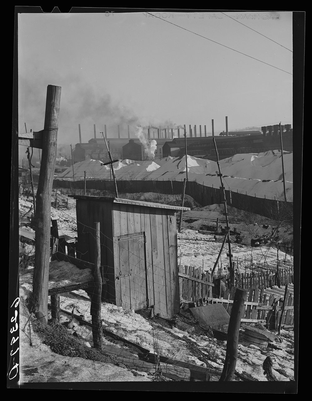 Backyards of company houses and steel mill. Midland, Pennsylvania. Sourced from the Library of Congress.