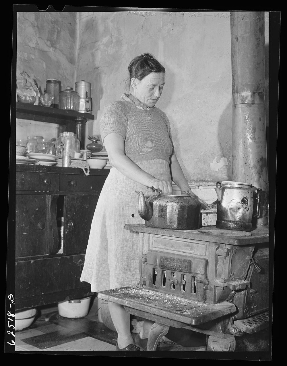 Mother of farm family from North Carolina who have come to Norfolk, Virginia for work in defense industries. Sourced from…