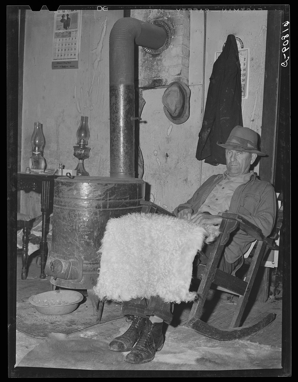 H.C. Richardson, Ozark farmer, with goat skin which has been bleached and washed. He sells these in town, three dollars.…