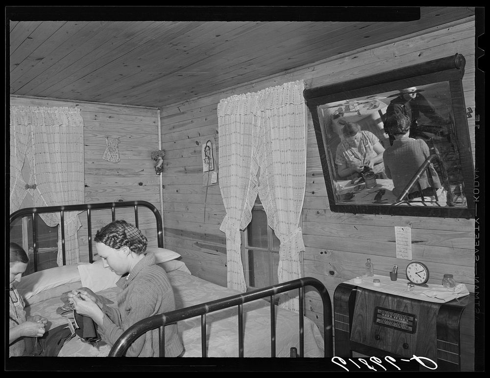 Combination living and bedroom in one of the four-room scattered labor homes built by FSA (Farm Security Administration) at…