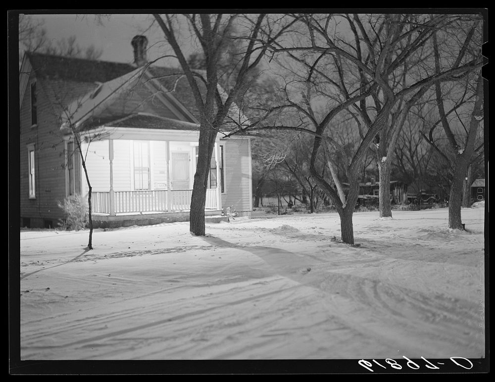 Porch light to welcome expected visitors. Pierre, South Dakota. Sourced from the Library of Congress.