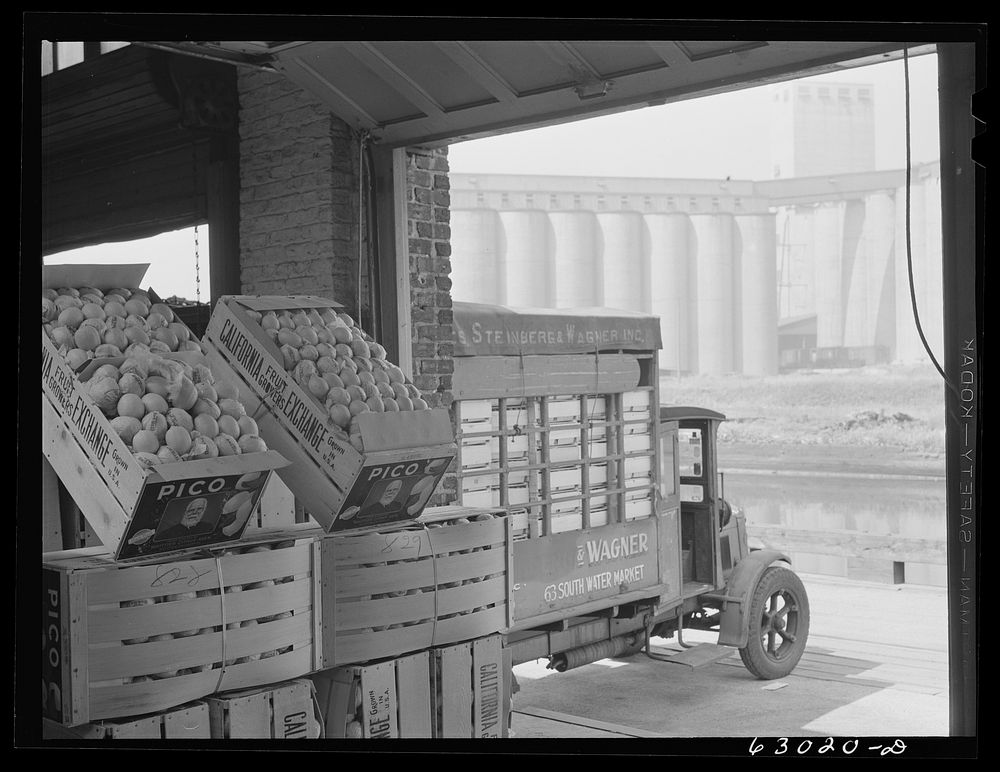Commission merchants truck loaded at fruit terminal warehouse. Chicago, Illinois. Sourced from the Library of Congress.