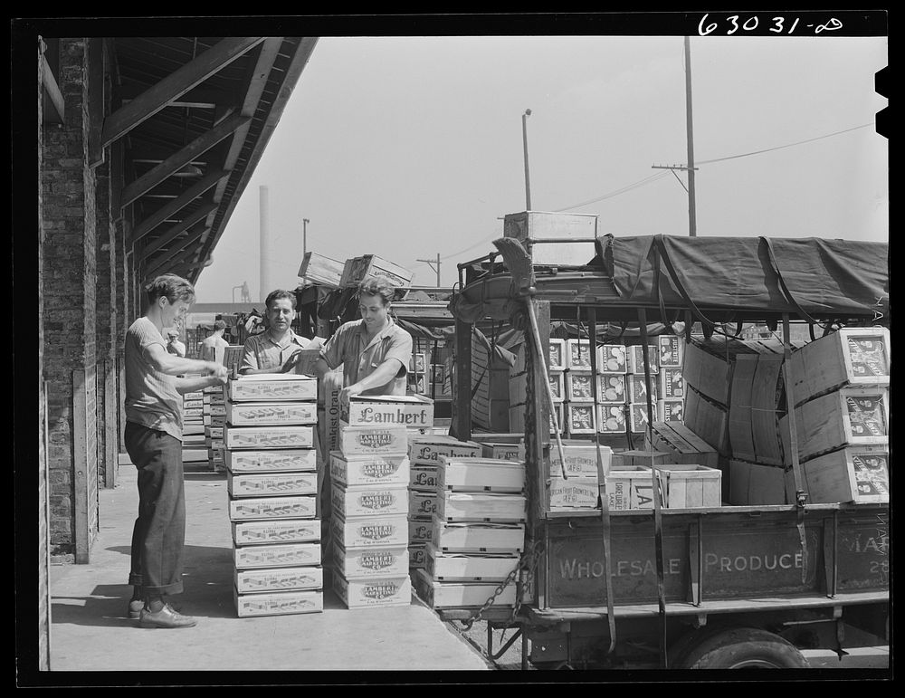 Loading crates of fruits into truck at fruit terminal. Chicago, Illinois. Sourced from the Library of Congress.
