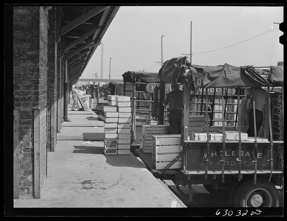 Loading crates of fruits into truck at fruit terminal. Chicago, Illinois. Sourced from the Library of Congress.