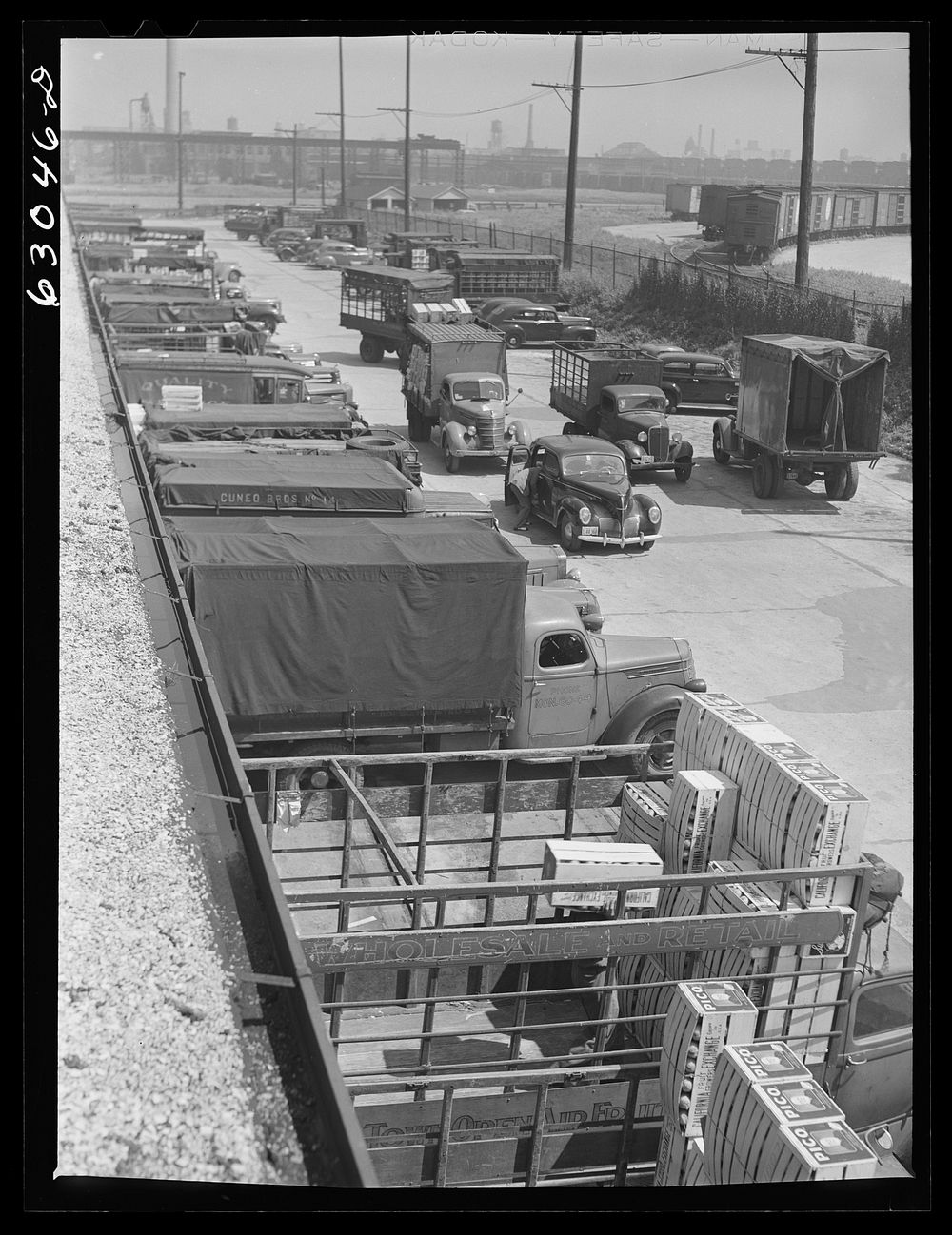 [Untitled photo, possibly related to: Trucks of commission merchants lined up outside fruit terminal to haul produce market…