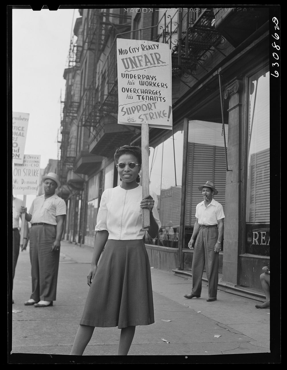 Girl in picket line. Mid-City Company, South Chicago, Illinois. Sourced from the Library of Congress.