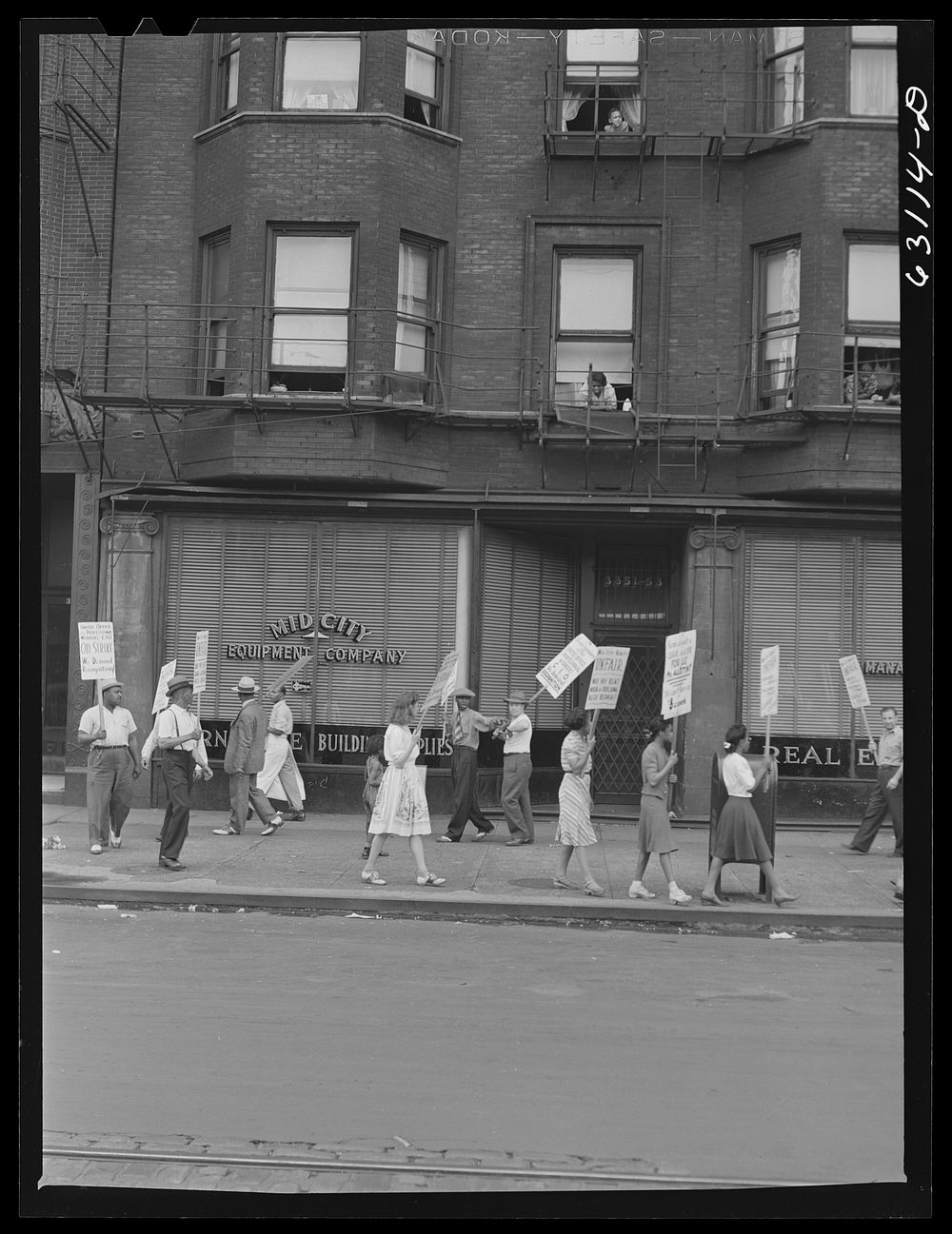 [Untitled photo, possibly related to: Picket line in front of Mid-City Realty Company. South Chicago, Illinois]. Sourced…