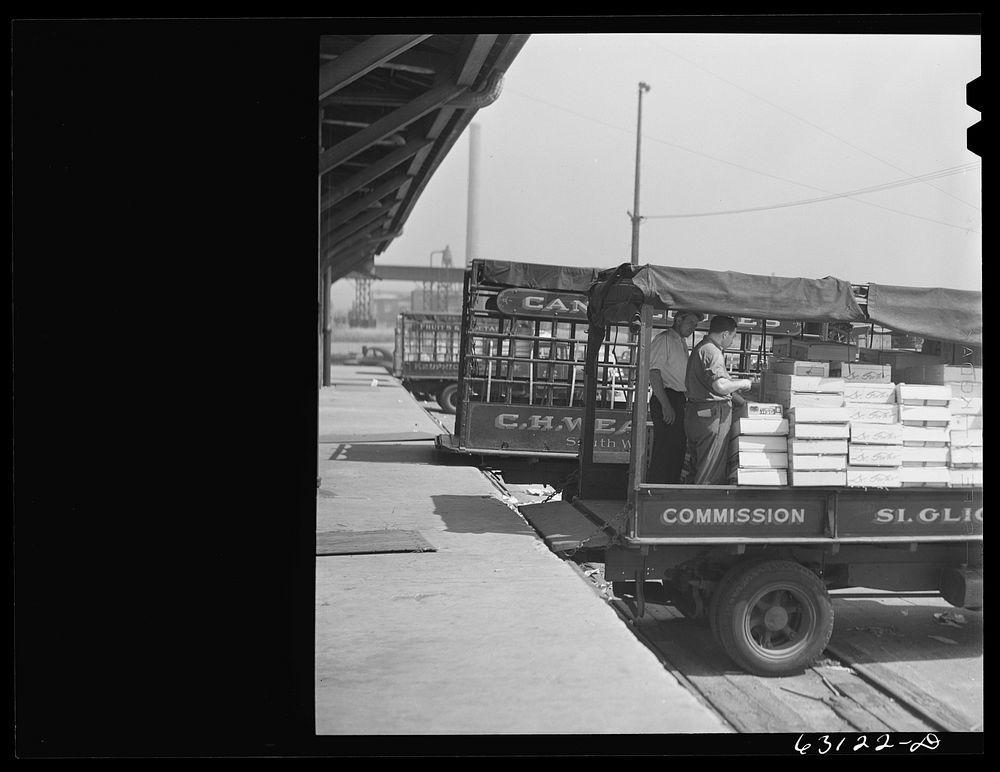[Untitled photo, possibly related to: Loading crates of fruits into truck at fruit terminal. Chicago, Illinois]. Sourced…
