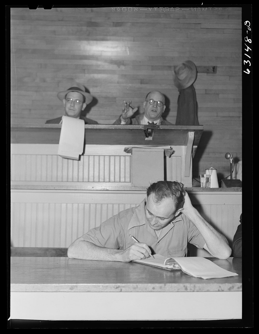 [Untitled photo, possibly realted to: Commission merchants bidding in auction at fruit terminal. Chicago, Illinois]. Sourced…