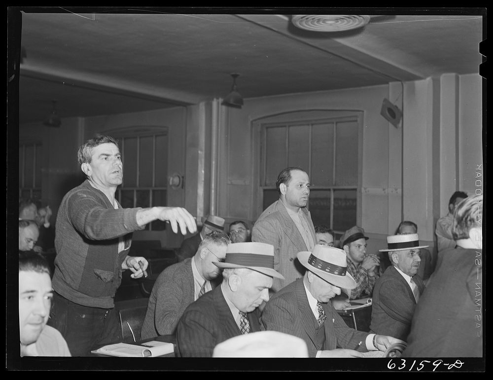 Commission merchants bidding on carload of fruit. Fruit terminal auction room. Chicago, Illinois. Sourced from the Library…