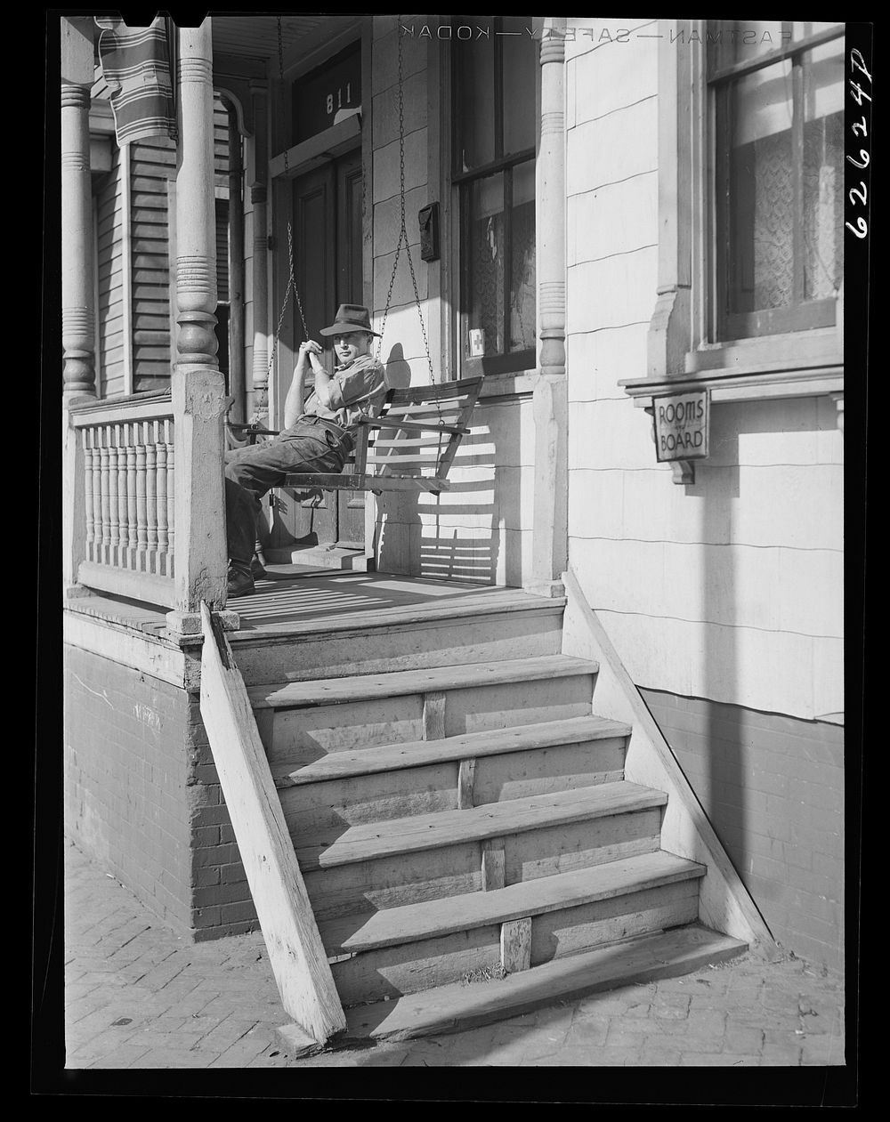 Front porch. Rooming house near Navy yard. Portsmouth, Virginia. Sourced from the Library of Congress.