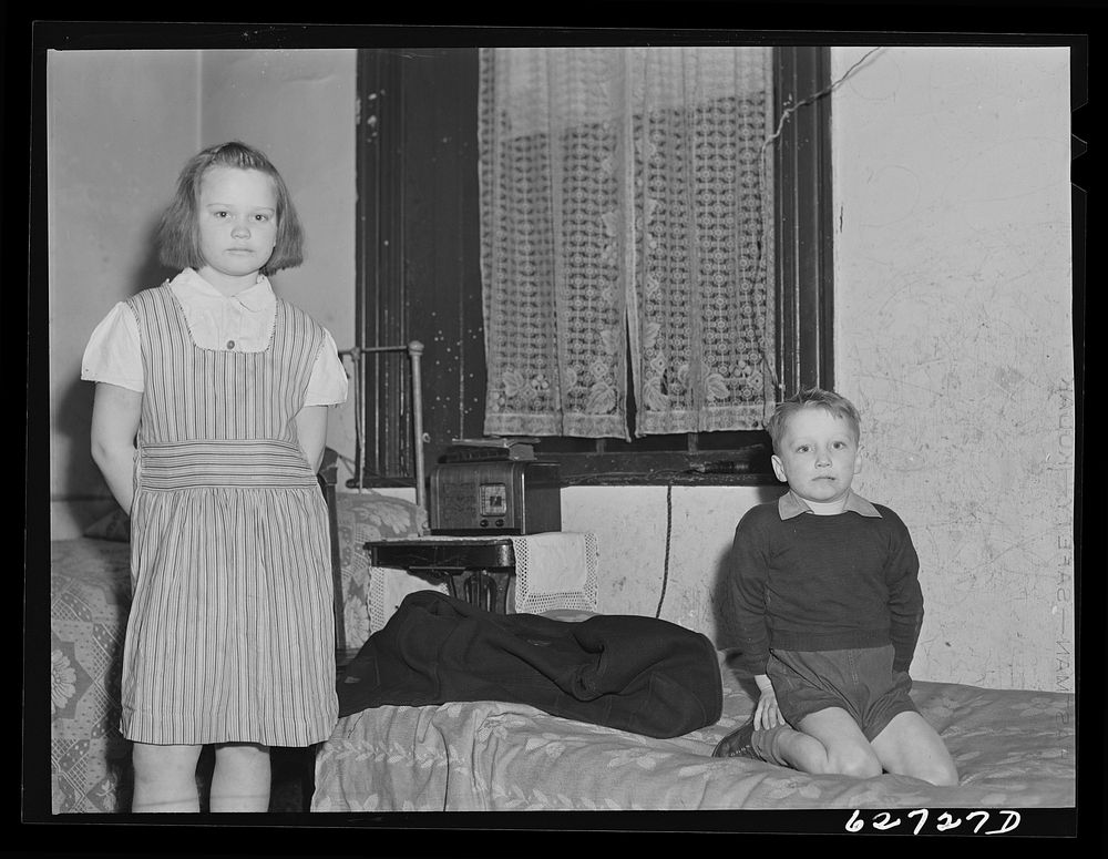 [Untitled photo, possibly related to: Mother and child of destitute family of five living in one room at Helping Hand…