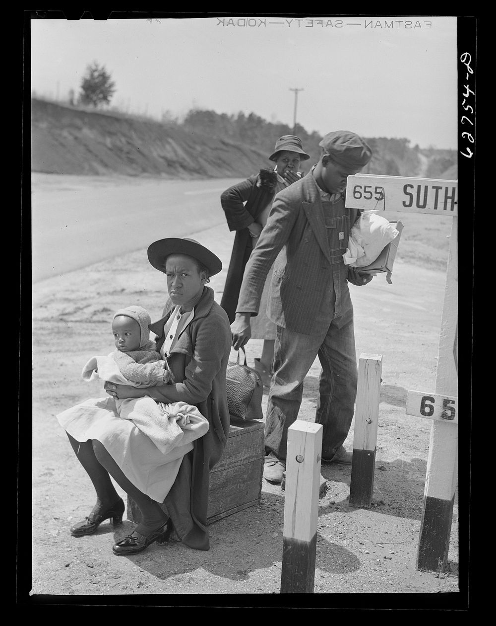  family waiting for ride into town. Halifax County, Virginia. Sourced from the Library of Congress.