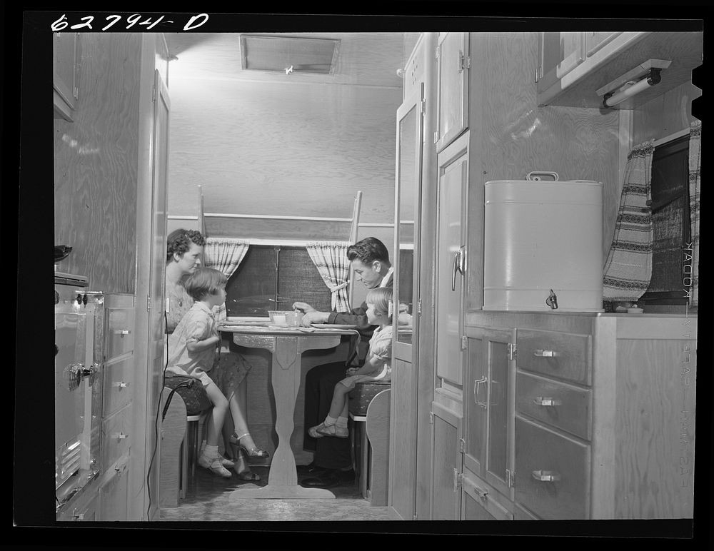 General Electric worker from Alabama at dinner with family in trailer home. FSA (Farm Security Administration) camp, Erie…