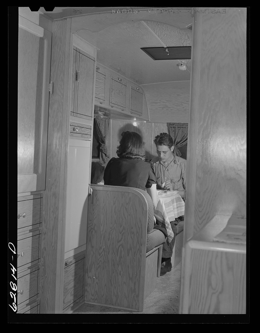 [Untitled photo, possibly related to: Jack Cutter and family at dinner. FSA (Farm Security Administration) trailer camp.…
