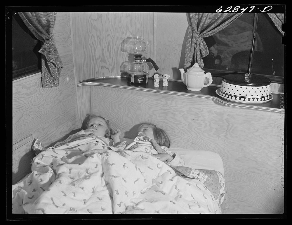 Children of Jack Cutter in bed in their trailer at FSA (Farm Security Administration) camp. Erie, Pennsylvania. Sourced from…