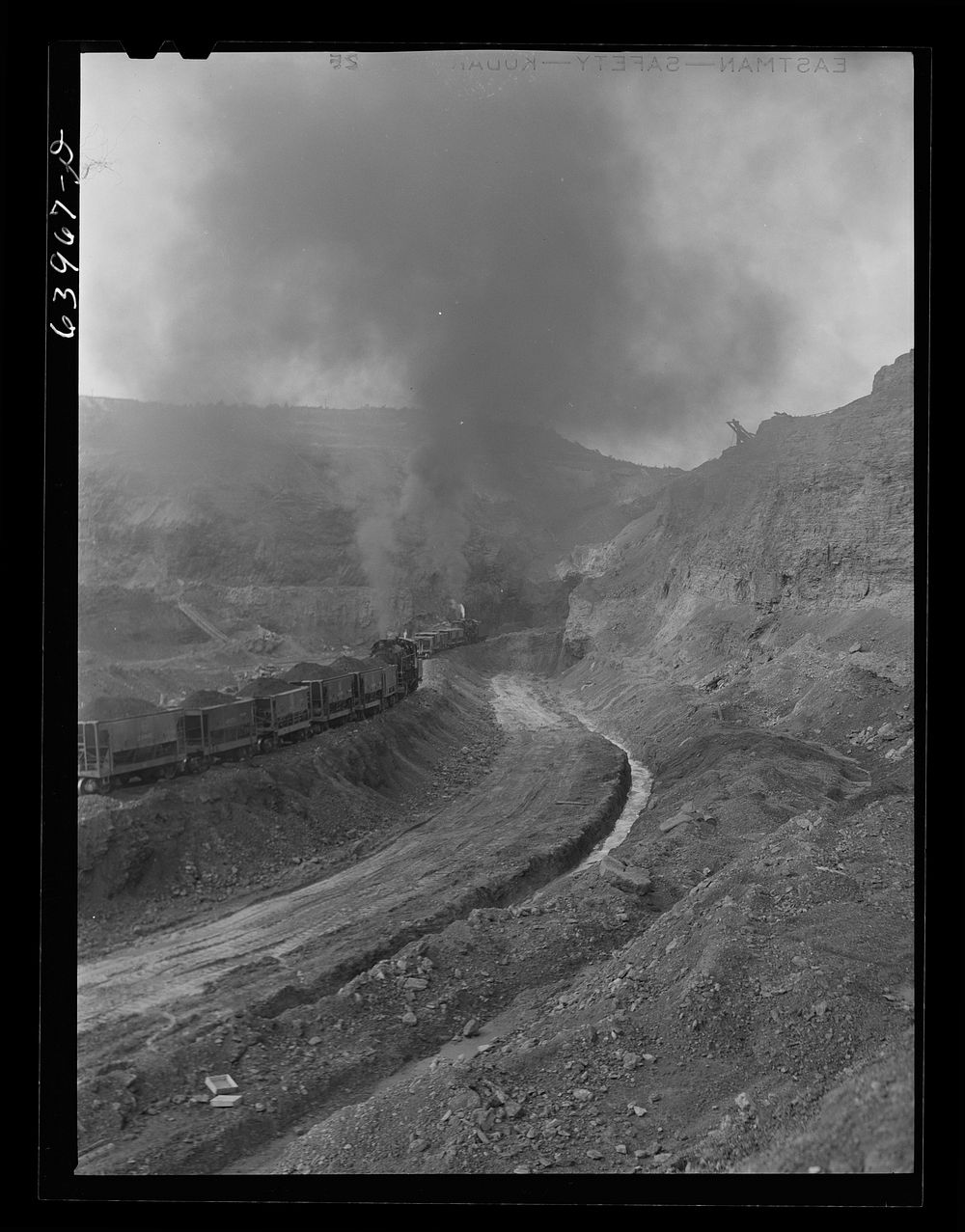 [Untitled photo, possibly related to: World's largest open pit mine, Hull Rust Mahoning. Near Hibbing, Minnesota]. Sourced…