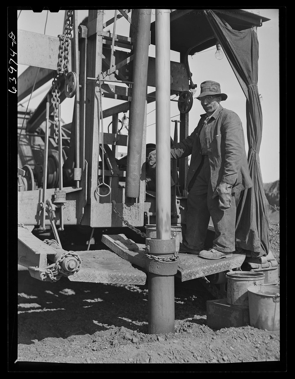 Vertical drill boring hole for blasting, Mahoning pit. Hibbing, Minnesota. Sourced from the Library of Congress.