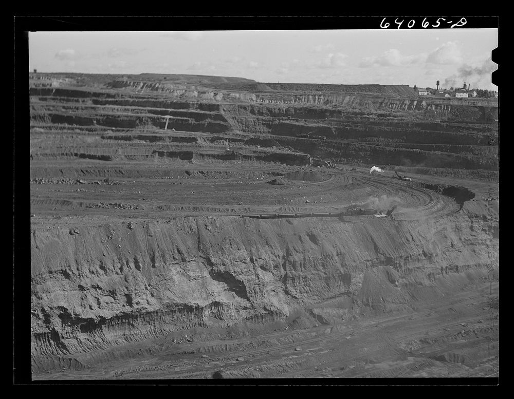 [Untitled photo, possibly related to: World's largest open pit iron mine at Hibbing, Minnesota. The pit is two and a half…