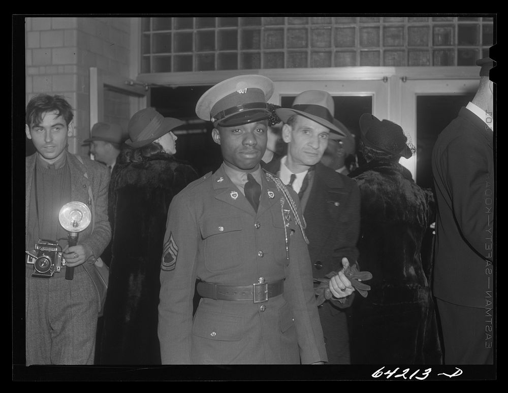 [Untitled photo, possibly related to: Washington, D.C. Christmas rush in the Greyhound bus terminal.  soldiers waiting for a…