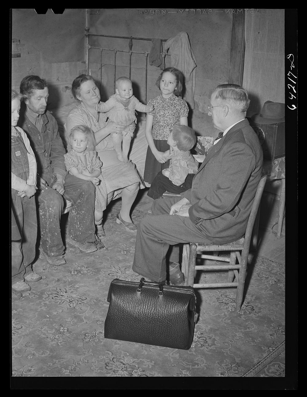 Scott County, Missouri. Country doctor visiting farm family. Sourced from the Library of Congress.