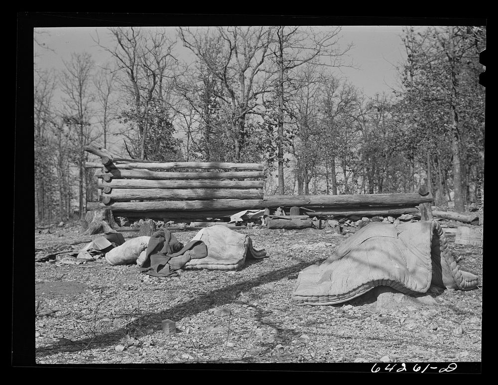 Newton County, Missouri. Camp Crowder area. Deserted home of Ozark farmer; his land was bought by the Army. Neighbors who…