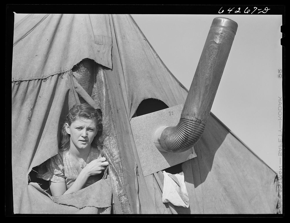 Newton County, Missouri. Camp Crowder area. Wife of construction worker from Oklahoma living in tent along U.S. Highway No.…