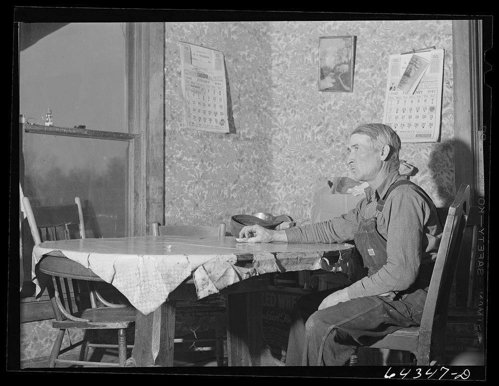 Newton County, Missouri. Camp Crowder area. James Mallory in his Ozark farmhouse. His land has been bought by the Army for…