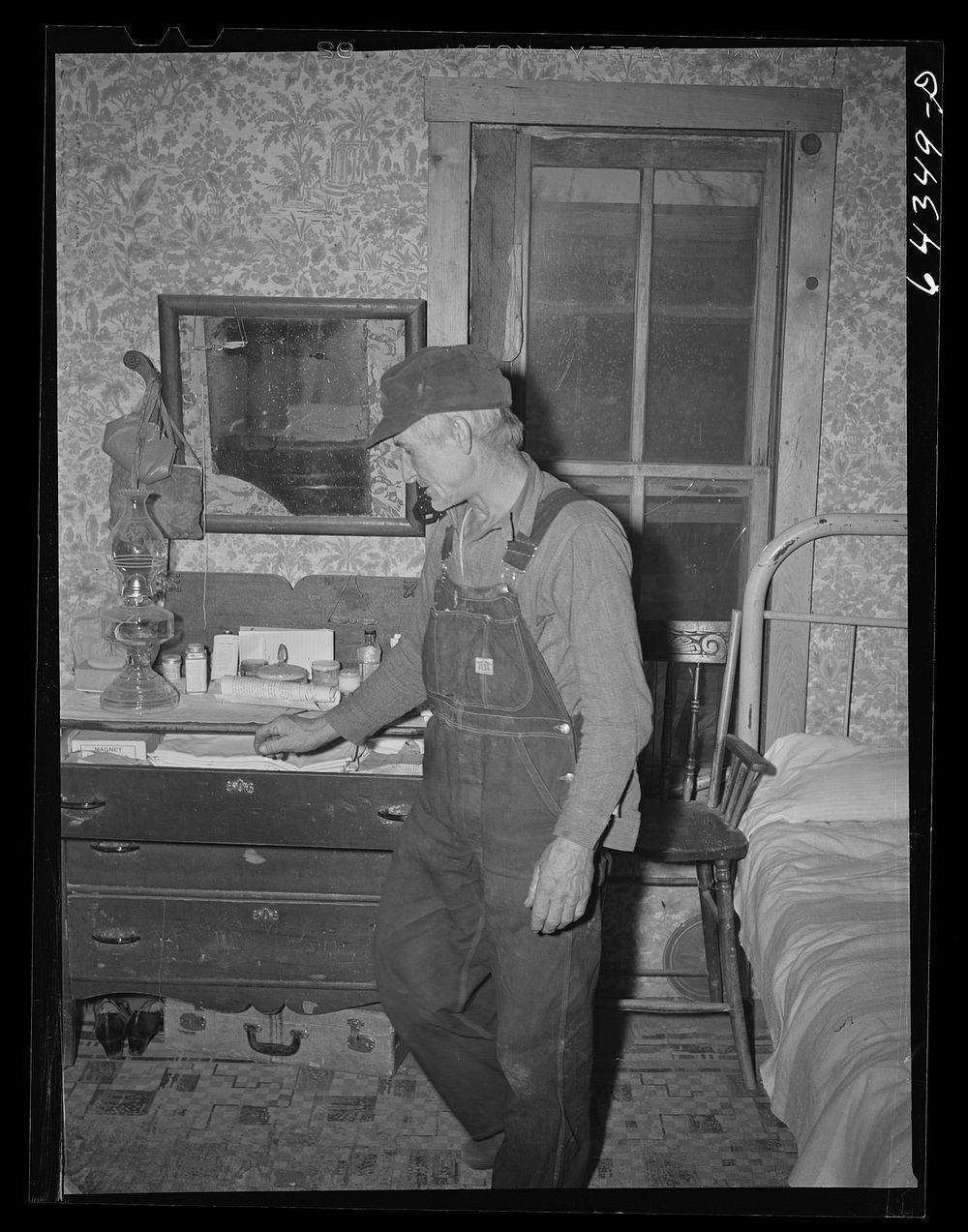 [Untitled photo, possibly related to: Newton County, Missouri. Camp Crowder area. James Mallory in his Ozark farmhouse. His…