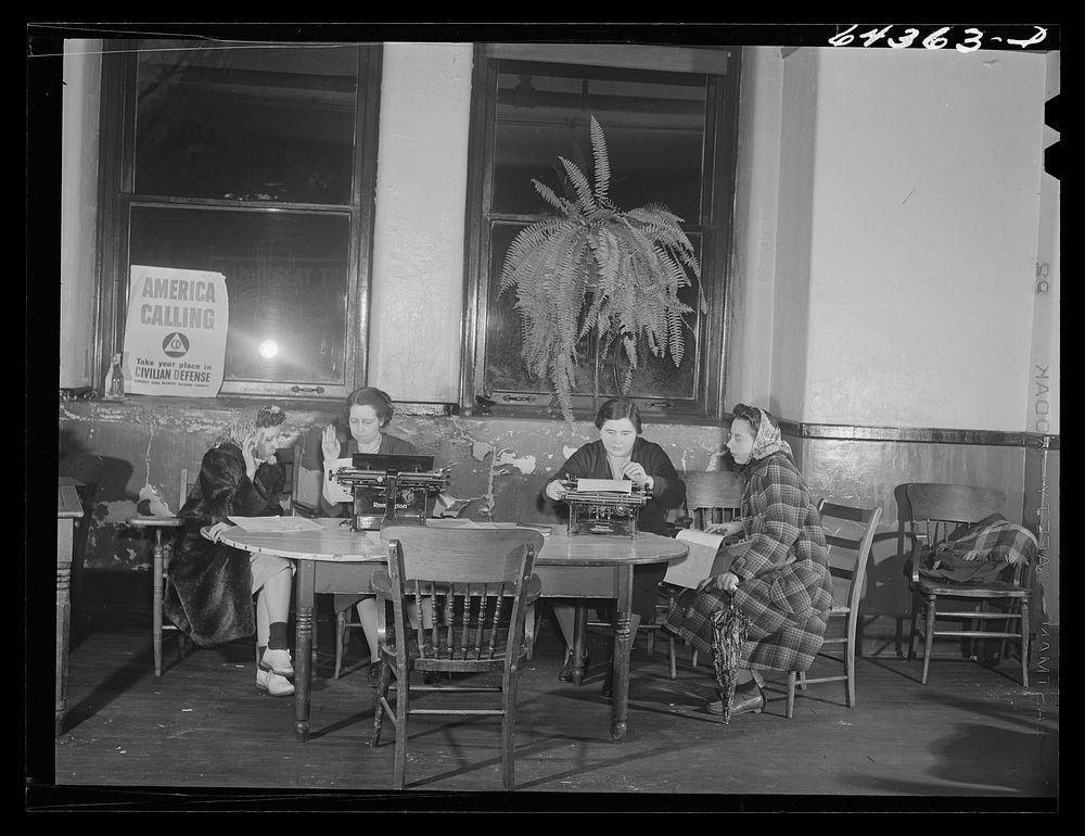 Marietta, Ohio. Housewives signing up for civilian defense in basement of the courthouse. Sourced from the Library of…