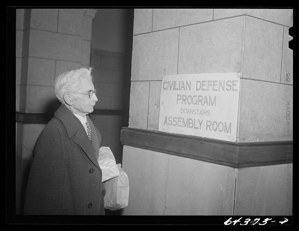 Marietta, Ohio. Old lawyer, veteran of Spanish-American war, entering courthouse to register for civilian defense. Sourced…