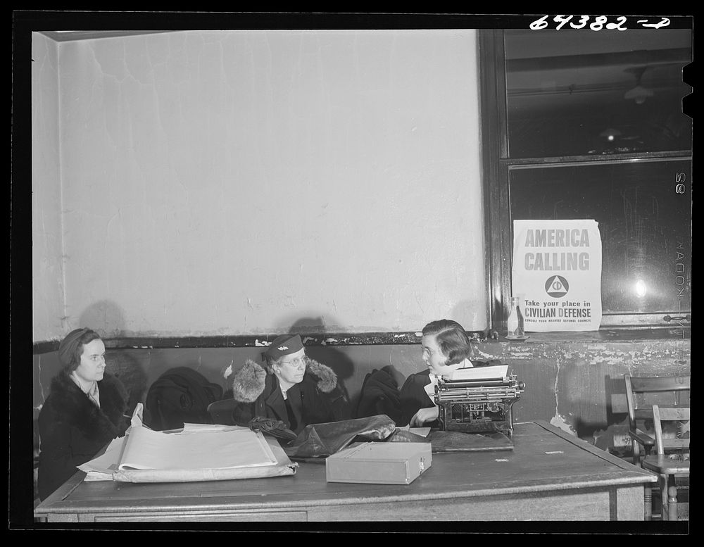 [Untitled photo, possibly related to: Marietta, Ohio. Housewives signing up for civilian defense in basement of the…